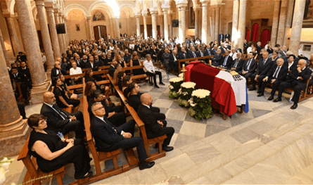 President Aoun gives Jean -Louie Mangi a presidential medal in Boom and farewell