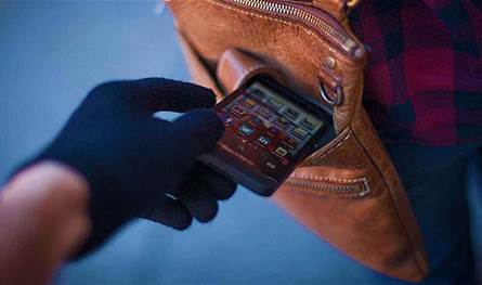 Security forces circulate photos of two suspects in the robbery of a phone store