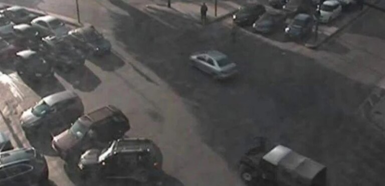 Bloody night: A barrage of bullets targets a store from a Chevrolet car.