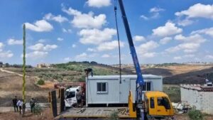 The first batch of prefabricated houses arrived in Zawtar Gharbiya and were distributed to the people