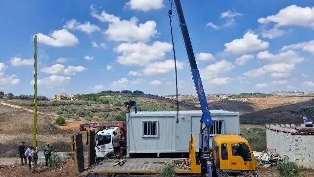 The first batch of prefabricated houses arrived in Zawtar Gharbiya and were distributed to the people