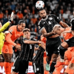 A fatal header by Khakpo gives the Netherlands a valuable draw against Germany and Greece takes the lead